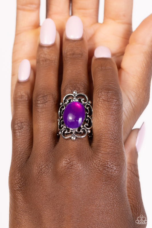 <p>A glassy purple bead glistens atop a backdrop of silver vine-like filigree, blooming into an enchanting pop of color atop the finger. Features a stretchy band for a flexible fit.</p> <p><i> Sold as one individual ring.</i></p>