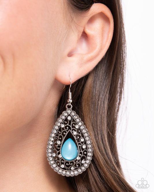 <p>A glimmering Harbor Blue acrylic teardrop seemingly floats inside a border of studded silver filigree, resulting in an enchanting scalloped frame. A smattering of glassy white rhinestones are sprinkled along the vine-like backdrop, matching the outer rim of white rhinestones for a tasteful finish. Earring attaches to a standard fishhook fitting.</p> <p><i> Sold as one pair of earrings.</i></p>
