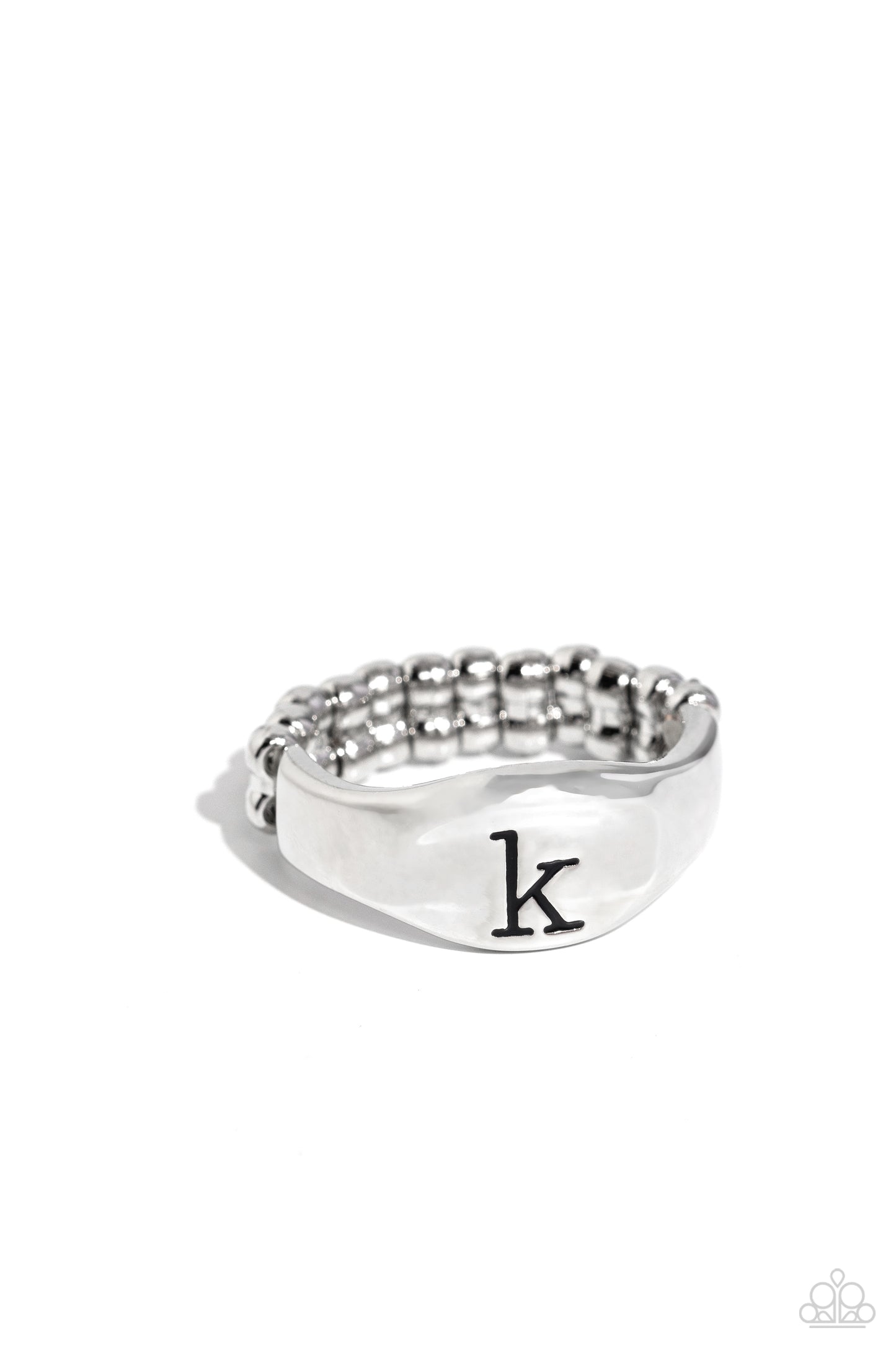 <p>Pressed into the center of a beveled silver band, the black letter "k" stands out for a simple, sentimental centerpiece. Features a stretchy band for a flexible fit.</p> <p><i> Sold as one individual ring.</i></p>