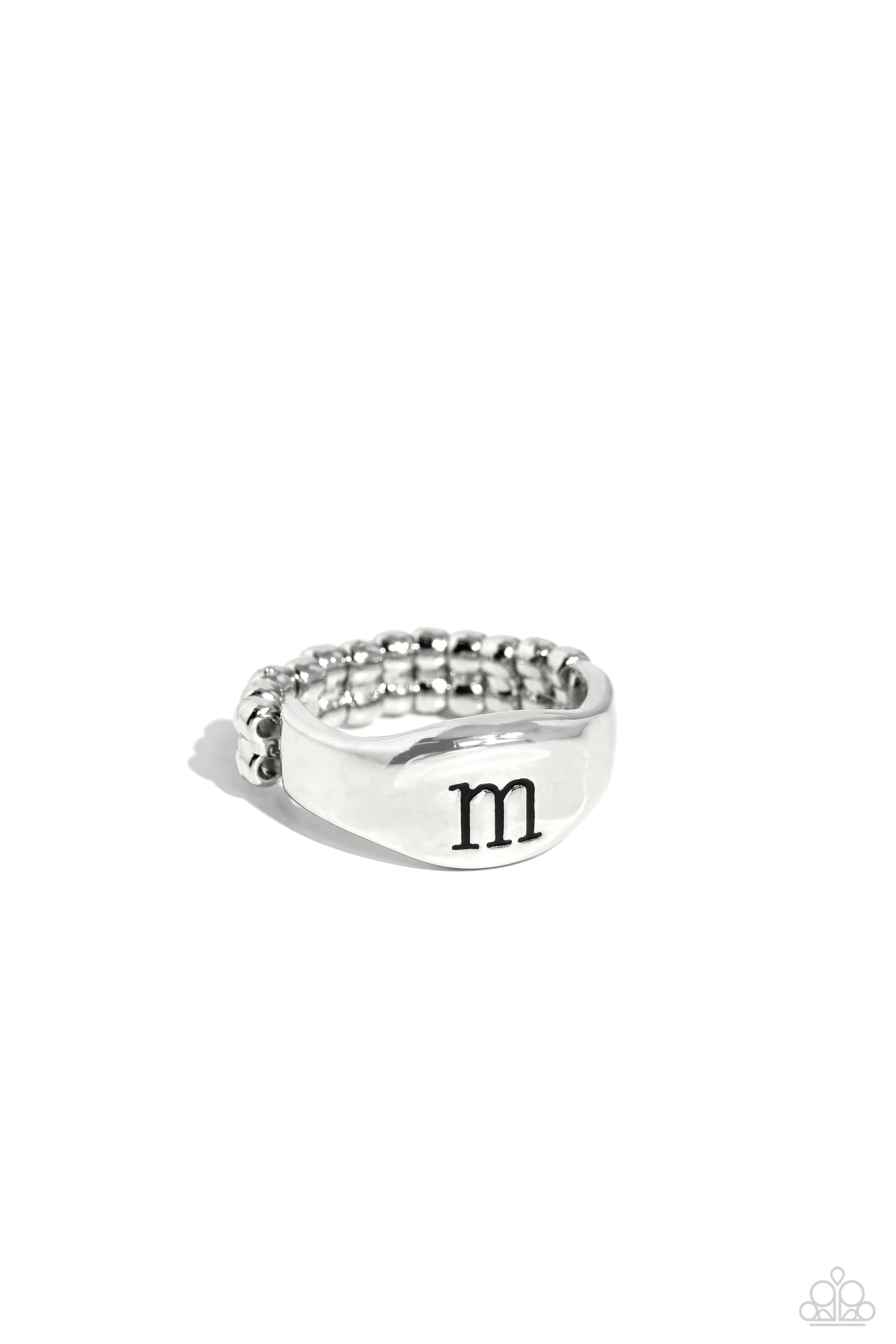 <p>Pressed into the center of a beveled silver band, the black letter "m" stands out for a simple, sentimental centerpiece. Features a stretchy band for a flexible fit.</p> <p><i> Sold as one individual ring.</i></p>
