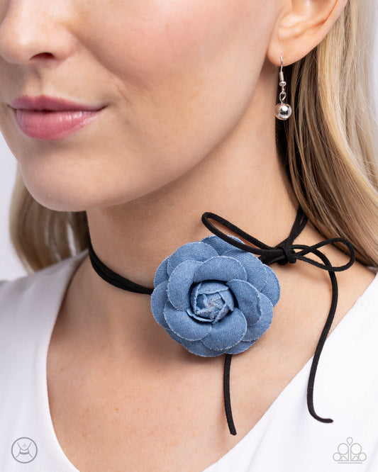 <p>Featuring tactile detail, a three-dimensional, oversized denim rose slides along strips of black suede, creating a Western floral-inspired centerpiece around the collar. Features an adjustable clasp closure.</p> <p><i>Sold as one individual choker necklace. Includes one pair of matching earrings. </i></p> &nbsp;<img src="https://d9b54x484lq62.cloudfront.net/paparazzi/shopping/images/517_chokericon_1.jpg" alt="Choker" align="middle" height="50" width="50">