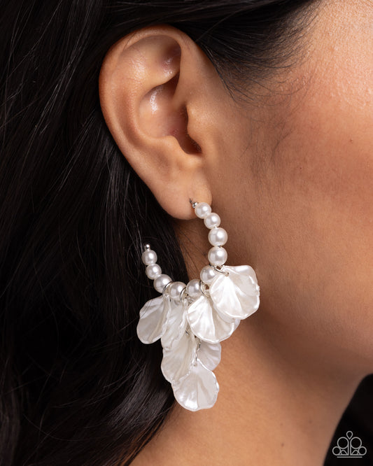 <p>Scalloped white pearl petals cascade from silver fittings in a refined array from gleaming white pearls that curl around the ear for a classy display. Earring attaches to a standard post fitting. Hoop measures approximately 1" in diameter.</p> <p><i> Sold as one pair of hoop earrings.</i></p>
