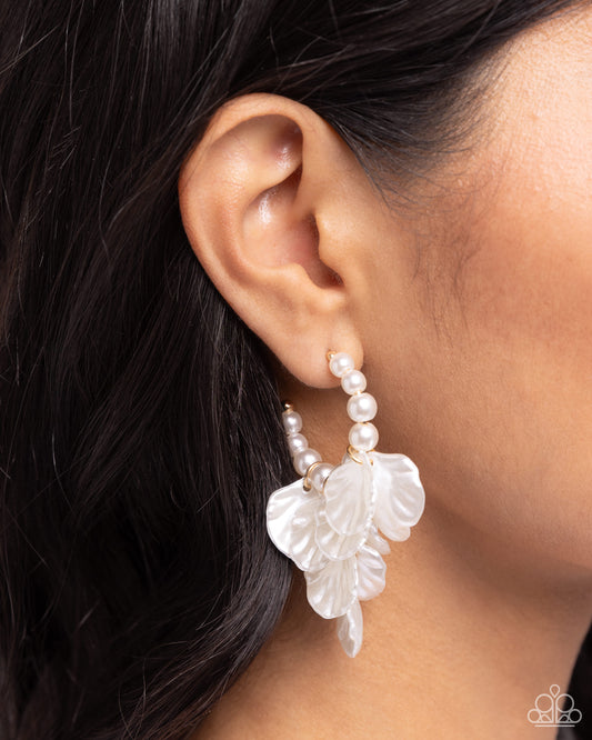 <p>Scalloped white pearl petals cascade from gold fittings in a refined array from gleaming white pearls that curl around the ear for a classy display. Earring attaches to a standard post fitting. Hoop measures approximately 1" in diameter.</p> <p><i> Sold as one pair of hoop earrings.</i></p>