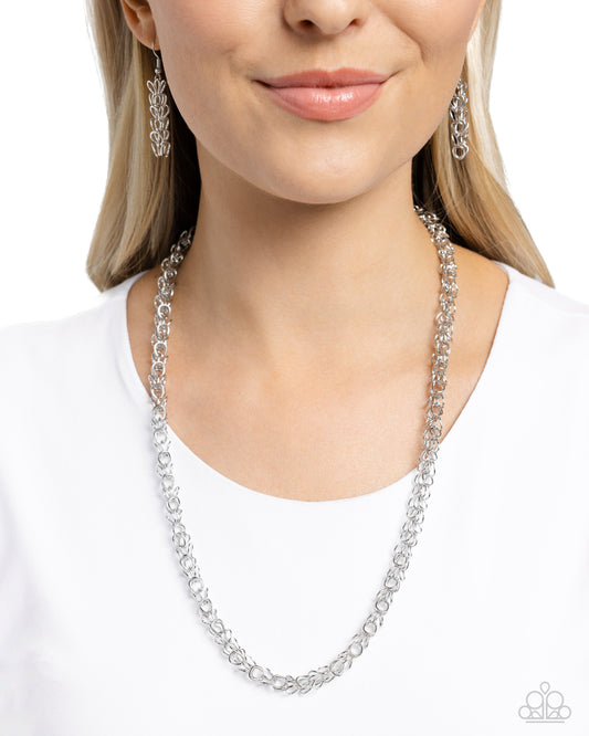 <p>An airy, abstract silver chain loops below the neckline for a simply, streamlined statement. Features an adjustable clasp closure.</p> <p><i> Sold as one individual necklace. Includes one pair of matching earrings.</i></p>
