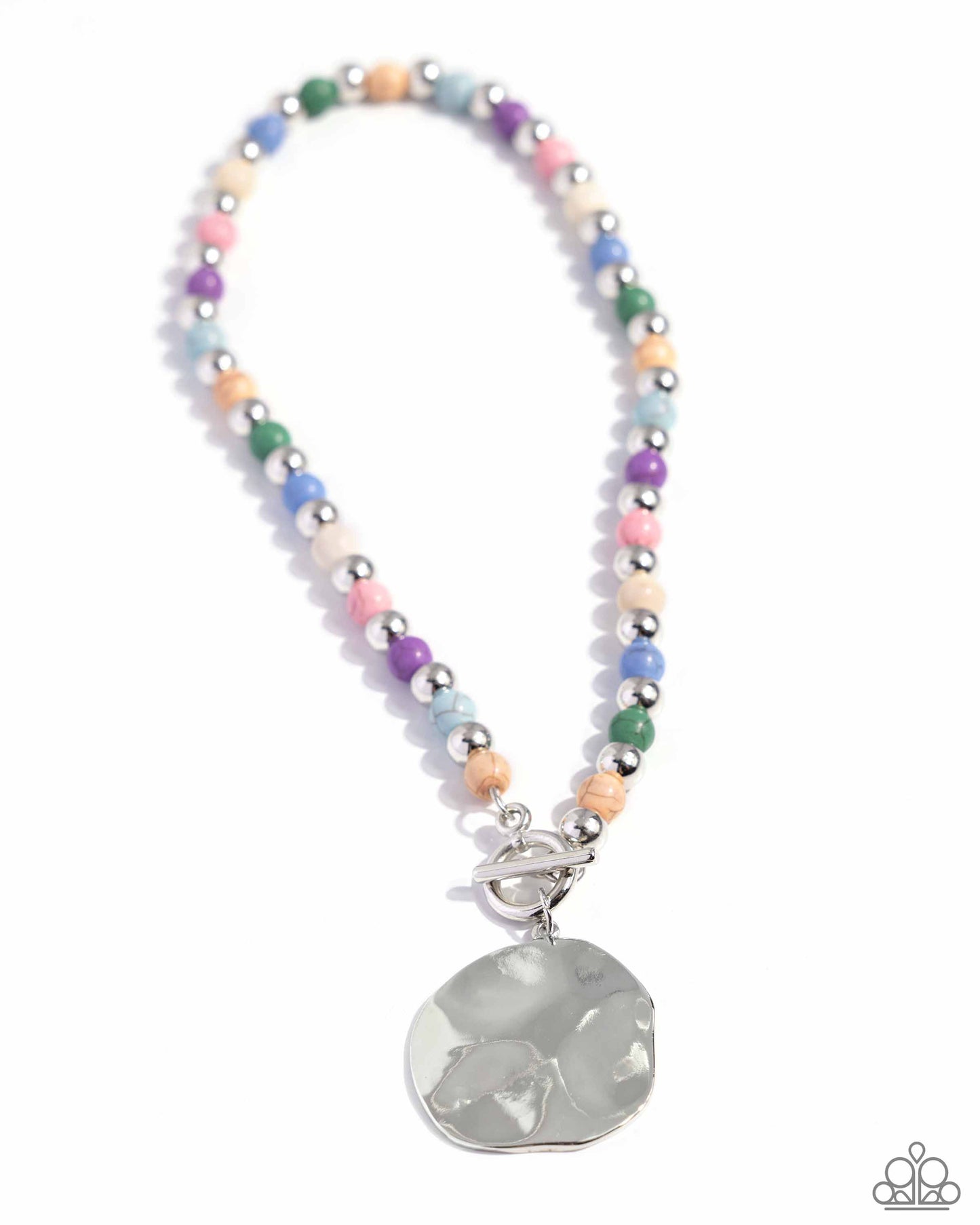 <p>Infused along an invisible string, colorful stones alternate with high-sheen silver beads as they connect through a toggle closure. A hammered oversized concaved silver disc cascades from the colorful strand for additional eye-catching detail. Features a toggle closure. As the stone elements in this piece are natural, some color variation is normal.</p> <p><i> Sold as one individual necklace. Includes one pair of matching earrings.</i></p>