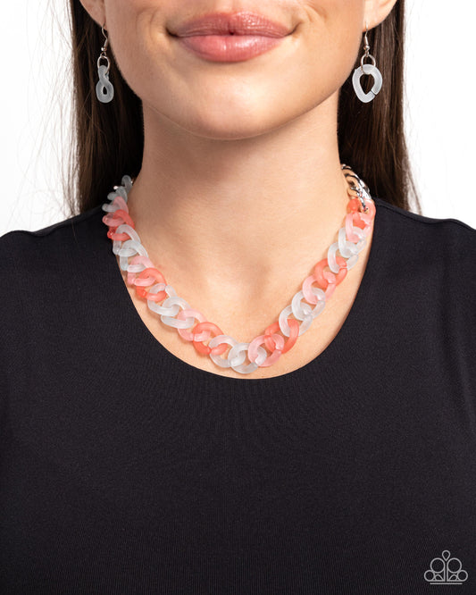 <p>Featuring a kaleidoscope of colors, blue, pink, and coral acrylic rings connect to high-sheen silver curb chain links for a magically multicolored display. Features an adjustable clasp closure.</p> <p><i> Sold as one individual necklace. Includes one pair of matching earrings.</i></p>