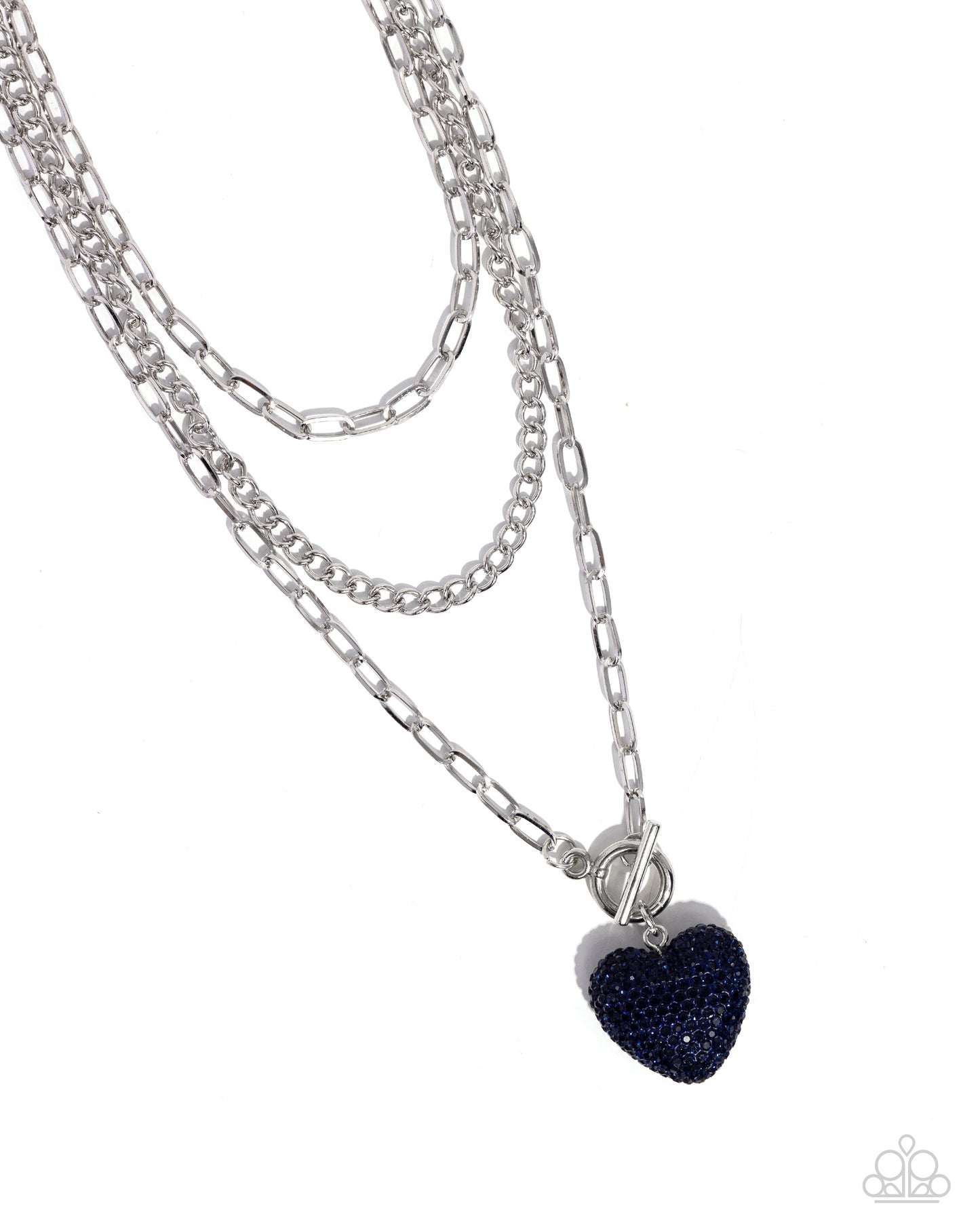 <p>Three mismatched silver chains coalesce and layer down the chest for a monochromatic display. A Montana-beaded heart charm dangles from the lowermost chain for a radically romantic finish. Features an adjustable clasp closure.</p> <p><i> Sold as one individual necklace. Includes one pair of matching earrings.</i></p>