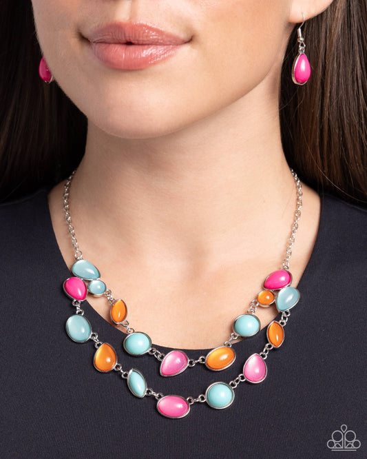 A mismatched collection of glossy and opaque tiffany, Pink Peacock, and orange teardrop, marquise, and round beads in silver frames delicately connect into a bubbly clustered pendant below the collar, creating a colorful statement piece. Features an adjustable clasp closure.  Sold as one individual necklace. Includes one pair of matching earrings. 
