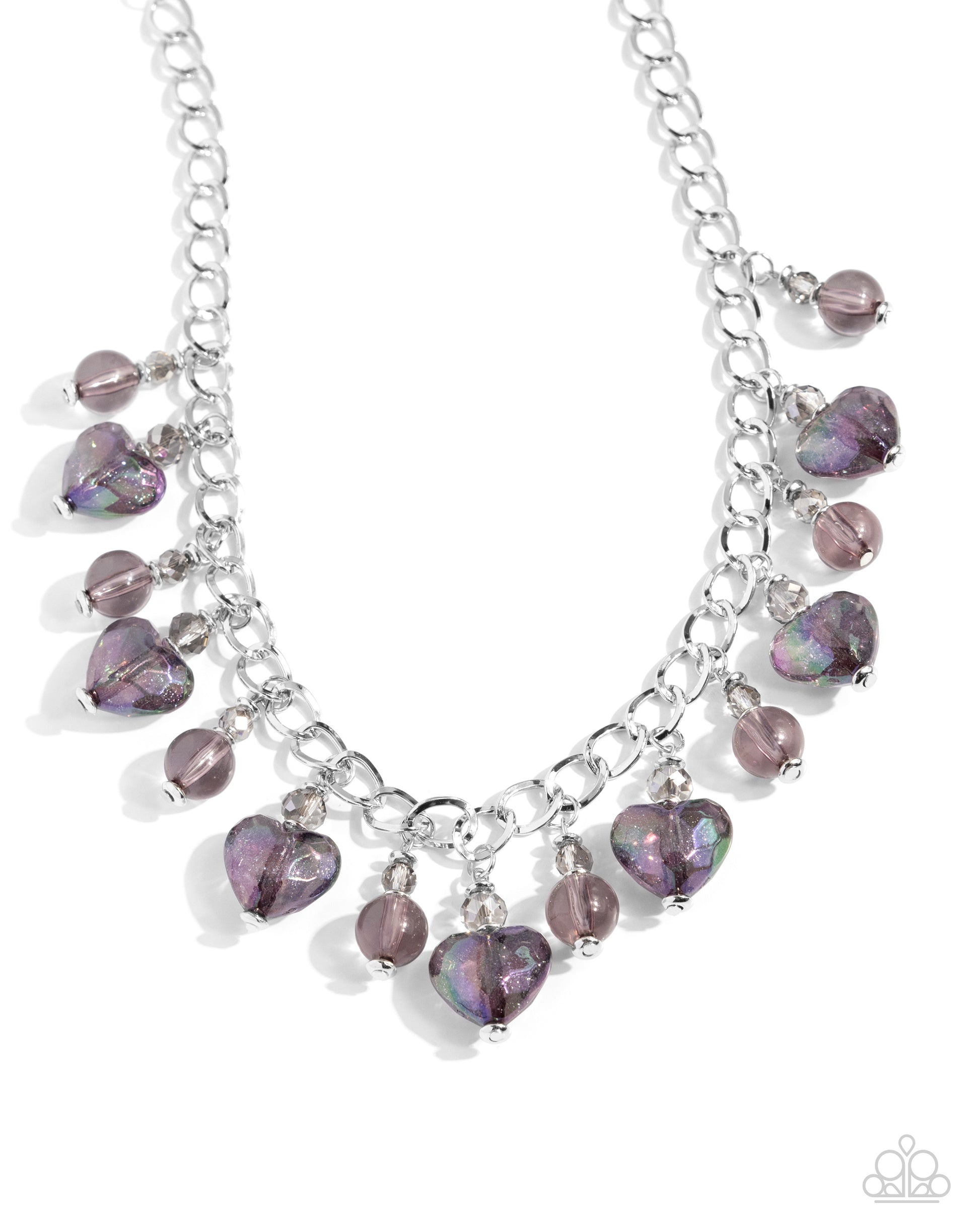 <p>A faceted smoky crystal-like bead gives way to sparkling black iridescent heart beads that alternate with round black beads from a thin silver curb chain for a calming, courting display. Features an adjustable clasp closure. Due to its prismatic palette, color may vary.</p> <p><i> Sold as one individual necklace. Includes one pair of matching earrings.</i></p>