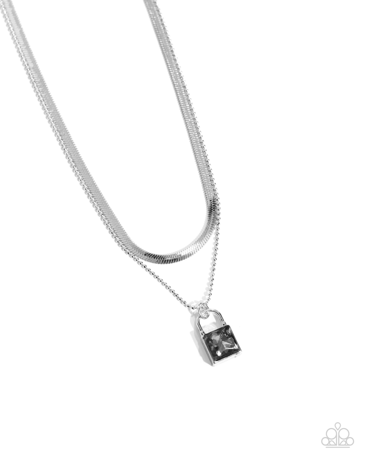 <p>Pressed in a silver padlock pendant, a smoky square gem glistens and glides along a dainty silver ball chain. Layered above the gritty glittery display, a silver herringbone chain creates additional edge and detail. Features an adjustable clasp closure.</p> <p><i> Sold as one individual necklace. Includes one pair of matching earrings.</i></p>