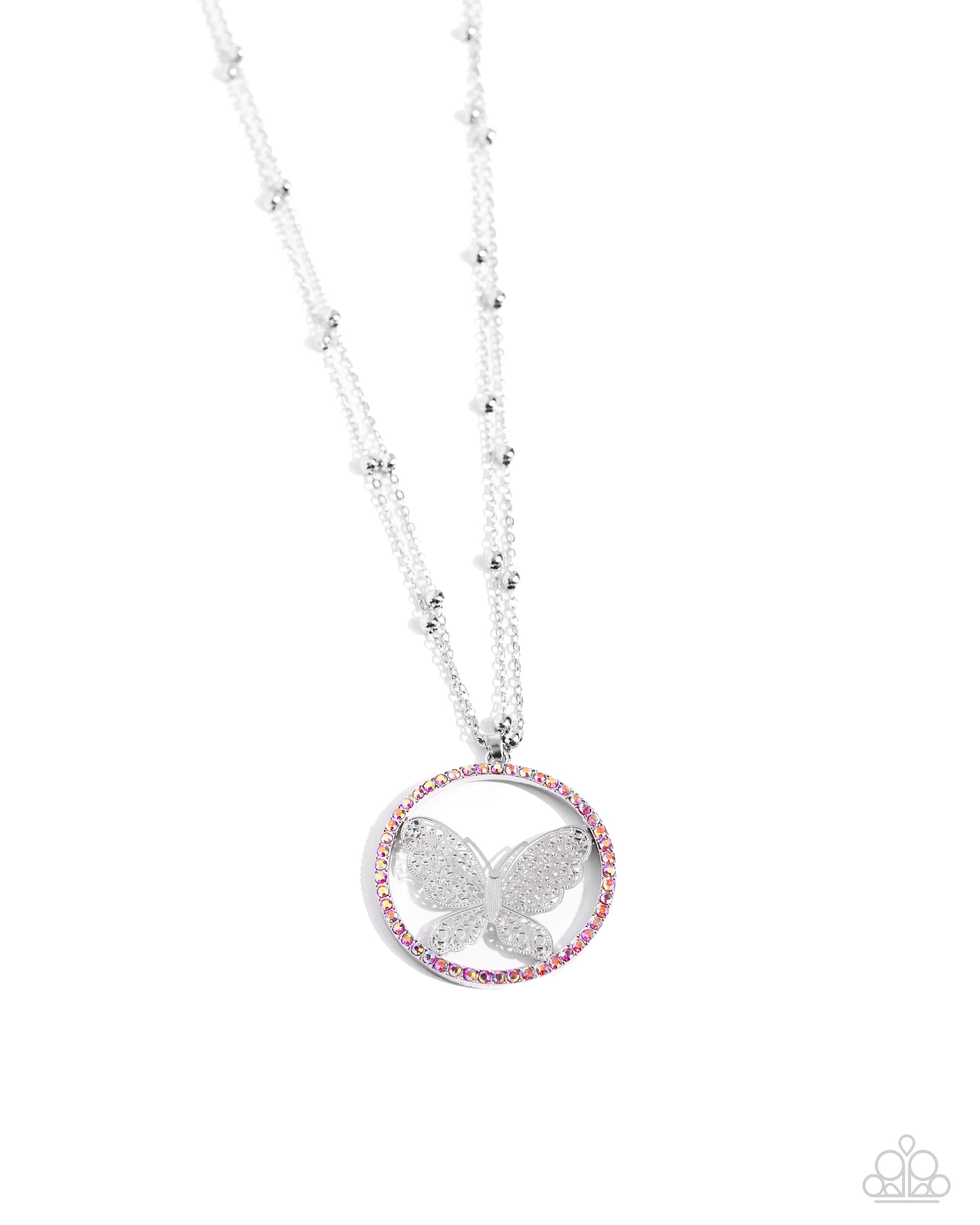 <p>Fluttering along a double-stranded silver satellite chain, a silver filigree butterfly, centered in a pink-iridescent rhinestone border twinkles below the neckline for a whimsical statement. Features an adjustable clasp closure. Due to its prismatic palette, color may vary.</p> <p><i> Sold as one individual necklace. Includes one pair of matching earrings.</i></p>