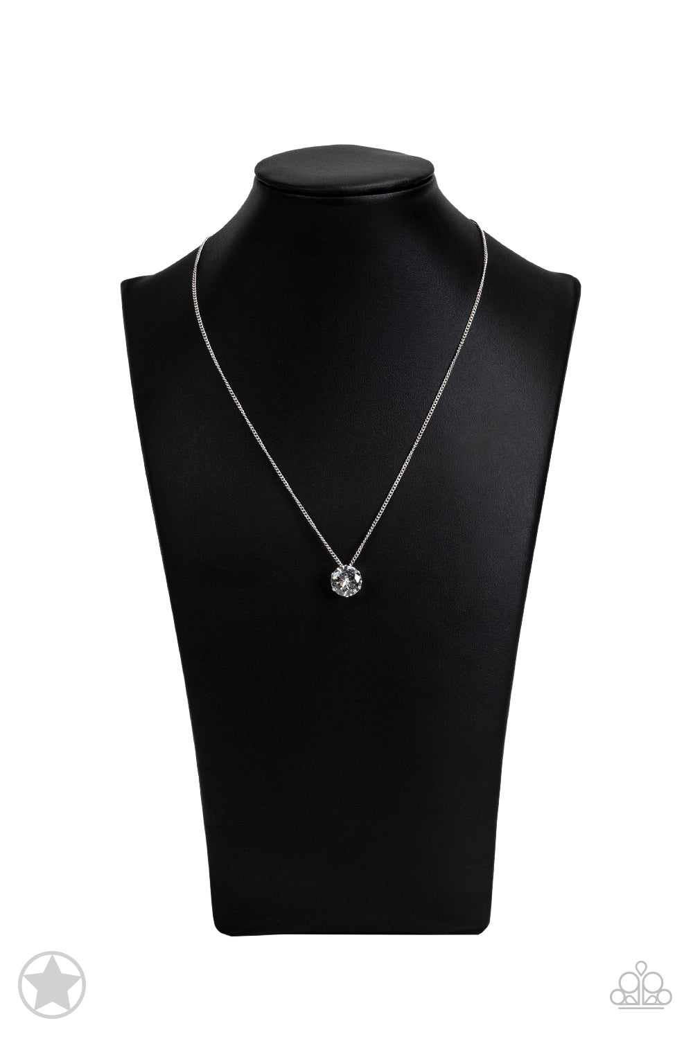 A single rhinestone sparkles brilliantly at the bottom of a dainty silver chain, creating a stunning solitaire design. Features an adjustable clasp closure.  Sold as one individual necklace. Includes one pair of matching earrings.