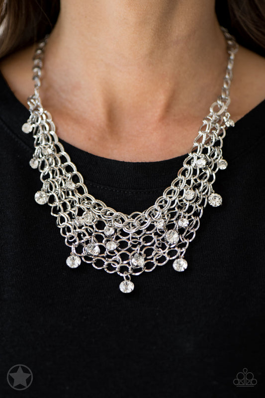 A collar of layered interlocking silver chain provides the canvas for gorgeous clear rhinestones to sway delicately. Features an adjustable clasp closure.    Sold as one individual necklace. Includes one pair of matching earrings.