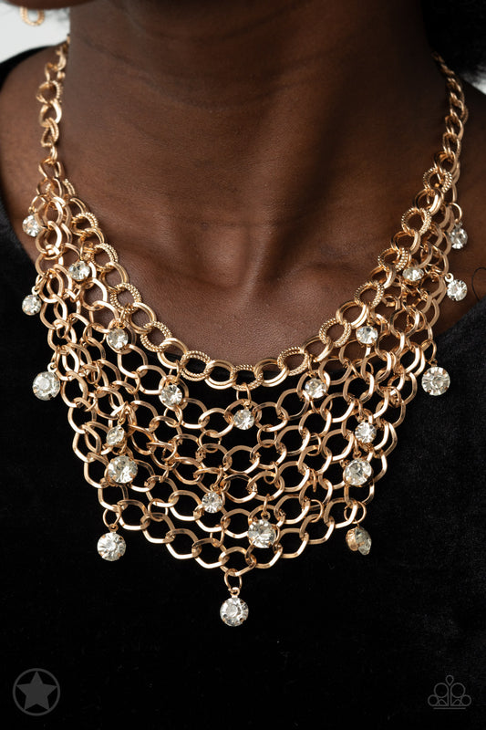 A collar of layered interlocking gold chain provides the canvas for gorgeous clear rhinestones to sway delicately. Features an adjustable clasp closure.  Sold as one individual necklace. includes one pair of matching earrings.