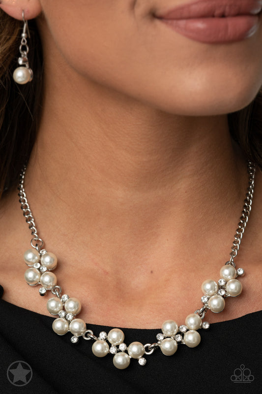 Dainty clusters of shimmery white pearls are dusted with sparkling rhinestones, creating a romantic, timeless design. Features an adjustable clasp closure.  Sold as one individual necklace. Includes one pair of matching earrings.   Get The Complete Look! Bracelet: "I Do" (Sold Separately)