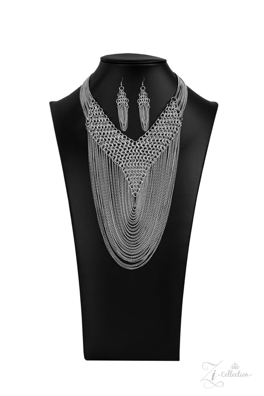 Suspended from the bottom of thickly layered chains, a rebellious mesh of silver links connect into an edgy V-shaped net. Tiers of dainty silver chains drape from the bottom of the net, creating radically layered shimmer across the chest. Features an adjustable clasp closure.  Sold as one individual necklace. Includes one pair of matching earrings.