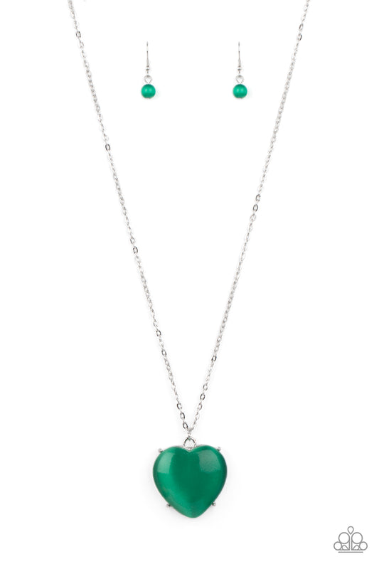 An oversized Mint cat's eye stone frame swings from the bottom of a lengthened silver chain, creating a flirtatious pendant. Features an adjustable clasp closure.  Sold as one individual necklace. Includes one pair of matching earrings.