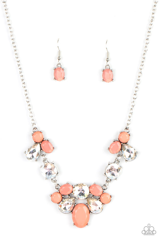 Varying in opacity and shape, mismatched Burnt Coral beads attach to oversized white rhinestones, creating bubbly frames that delicately link into an ethereal display below the collar. Features an adjustable clasp closure.  Sold as one individual necklace. Includes one pair of matching earrings.