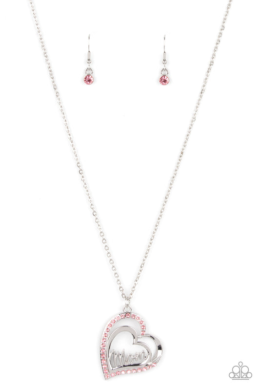 The word "Mom" floats inside an airy heart-shaped frame. A second heart encrusted with brilliant pink rhinestones encircles the centerpiece as it sways from a lengthened silver chain for a sweet token of love. Features an adjustable clasp closure.  Sold as one individual necklace. Includes one pair of matching earrings.