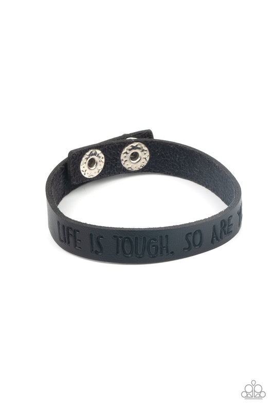A dainty black leather band is stamped in the phrase, "Life is tough. So Are You.," creating an inspiring centerpiece around the wrist. Features an adjustable snap closure.  Sold as one individual bracelet.