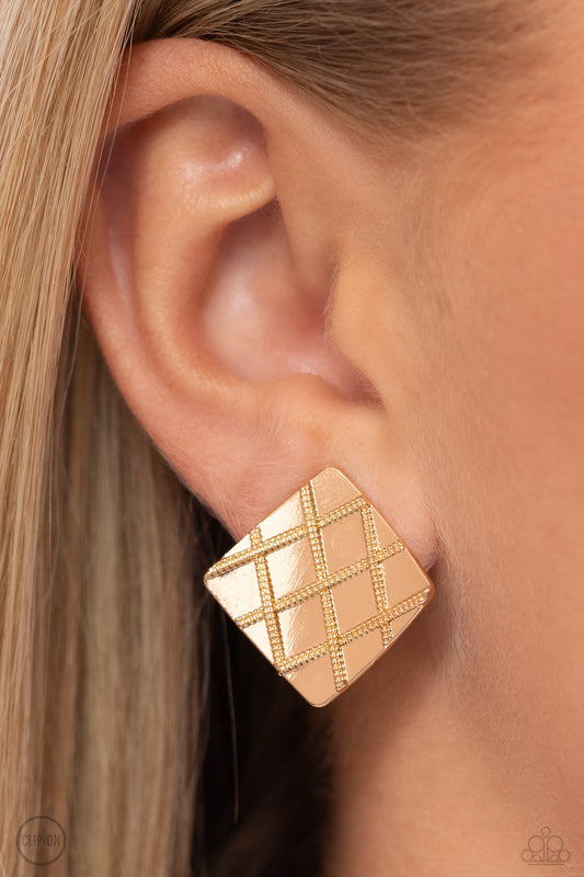 A curving gold square is embossed in a slanted plaid-like pattern, creating a tactile frame. Earring attaches to a standard clip-on fitting.  Sold as one pair of clip-on earrings.   Clip On Earring