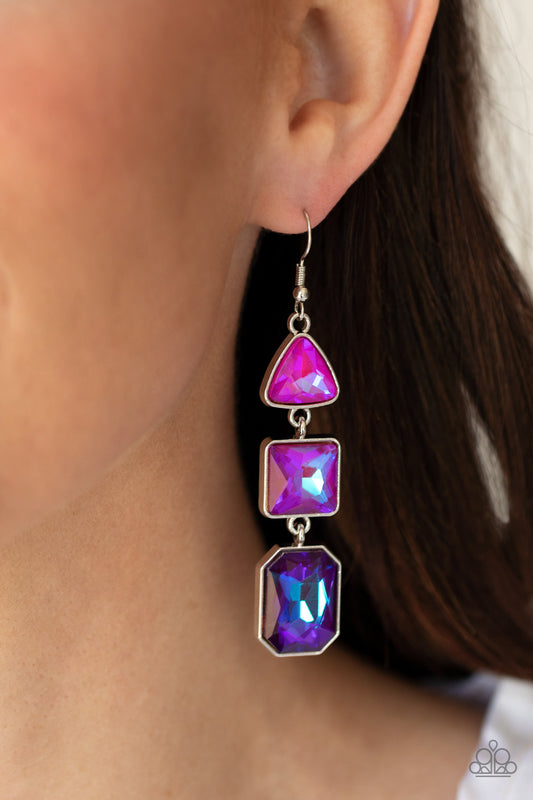 Featuring an iridescent UV shimmer, a trio of pink, purple, and blue geometrically shaped gems are pressed into silver frames that link together and culminate in a cosmically stellar lure. Earring attaches to a standard fishhook fitting.  Sold as one pair of earrings.