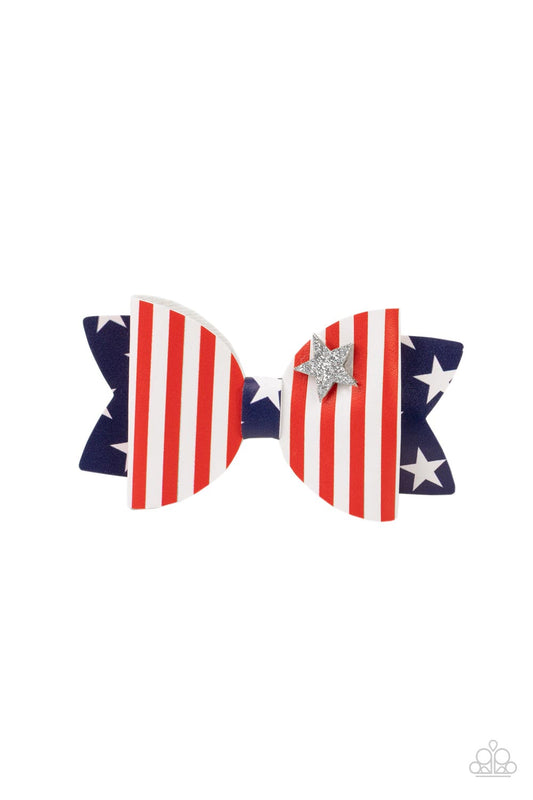 A glittery silver star dots the corner of a leathery bow adorned in red and white stripes and white stars against a blue background, creating a patriotic centerpiece. Features a standard hair clip on the back.  Sold as one individual hair clip.