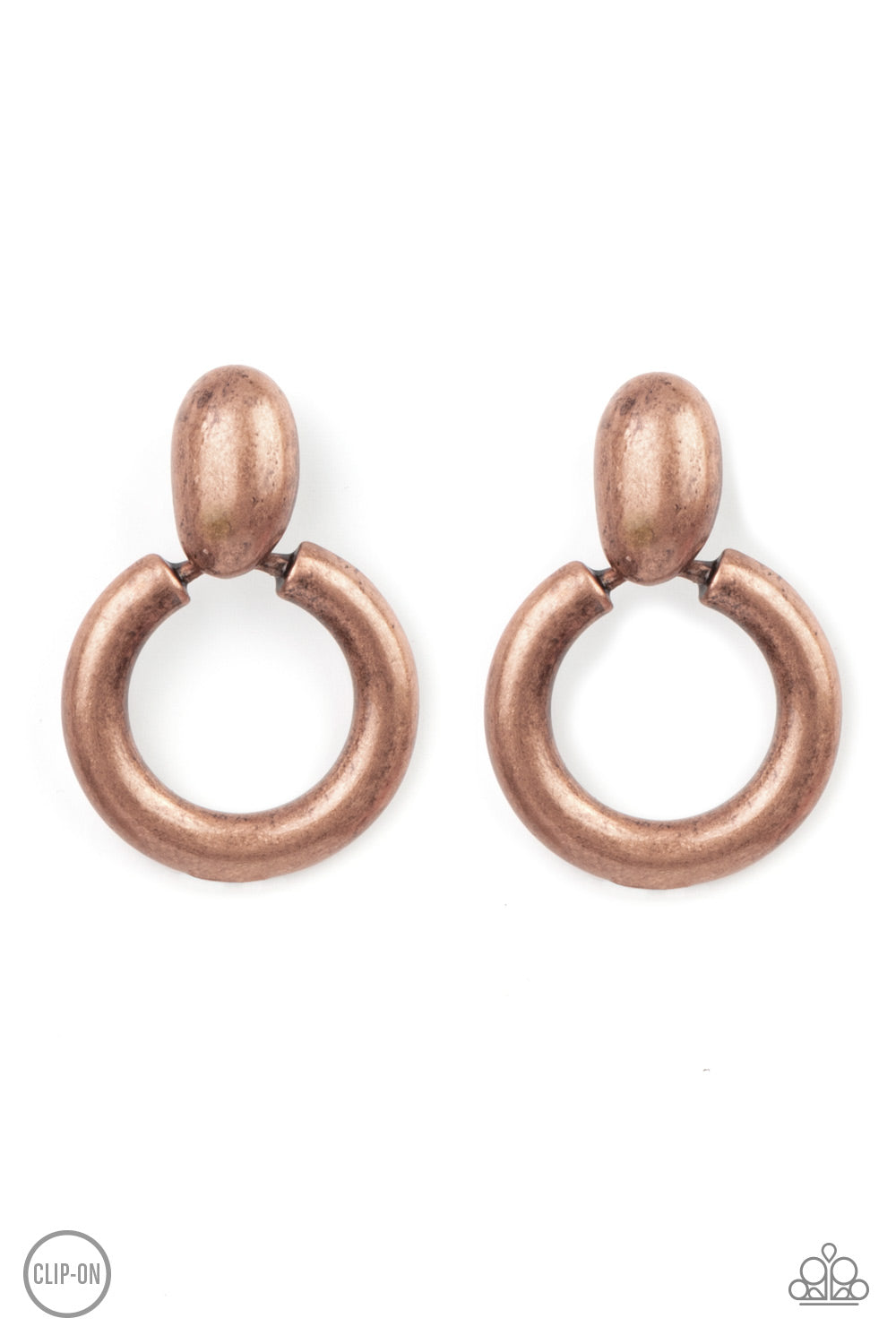 Brushed in an antiqued shimmer, a burnished copper hoop swings from the bottom of an asymmetrical copper fitting for a handcrafted flair. Earring attaches to a standard clip-on earrings.  Sold as one pair of clip-on earrings.  Clip On Earring