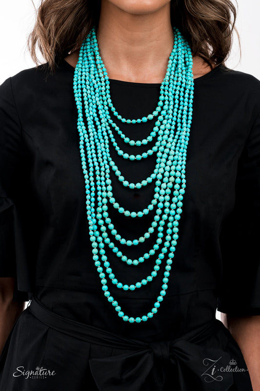 Intermixed with dainty silver beads, a groundbreaking display of refreshing turquoise stone beads gradually increases in size as they drape into artisan inspired layers down the chest. The trailblazing length combined with the authentic attitude of the piece creates an exaggerated, earthy statement. Features an adjustable clasp closure.
