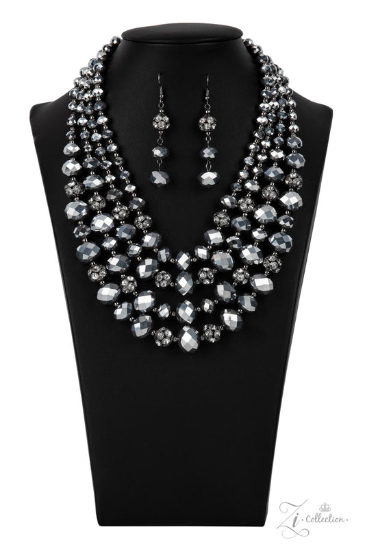 Gradually increasing in size and intensity, dainty gunmetal beads, faceted hematite-like crystals, and white rhinestone studded gunmetal ornaments unapologetically connect into dauntless rows below the collar. The radiantly regal layers flash and refract the light, creating a smoldering statement piece. Features an adjustable clasp closure.  Sold as one individual necklace. Includes one pair of matching earrings.