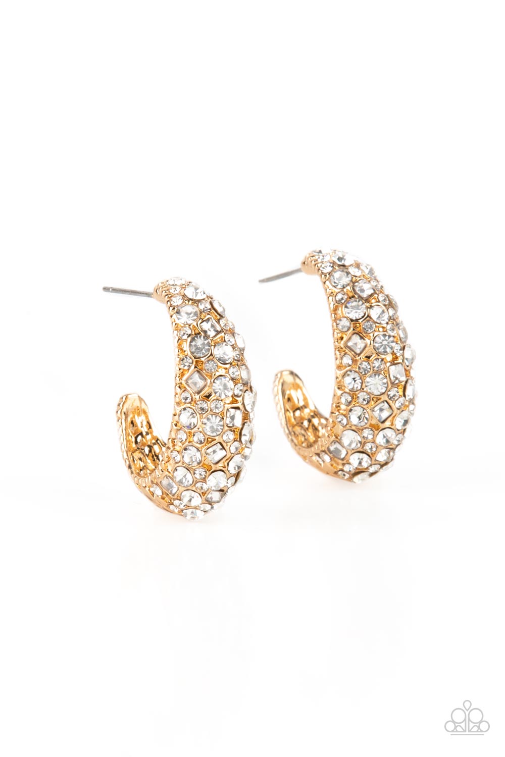 Featuring a beveled surface, a thick hammered gold hoop is haphazardly encrusted in round and square white rhinestones for a glamorously glittery finish. Earring attaches to a standard post fitting. Hoop measures approximately 3/4" in diameter.  Sold as one pair of hoop earrings.