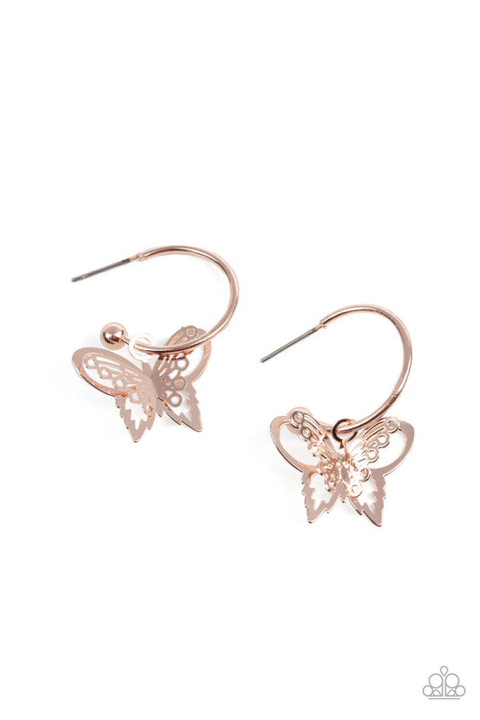 An airy rose gold butterfly charm glides along a dainty rose gold hoop, creating a fluttering fashion. Earring attaches to a post fitting. Hoop measures approximately 3/4" in diameter.  Sold as one pair of hoop earrings.