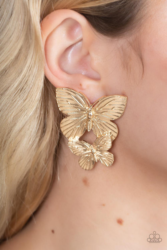 Veined with lifelike textures, a pair of golden butterflies flutters from the ear for a whimsical fashion. Earring attaches to a standard post fitting.  Sold as one pair of post earrings.