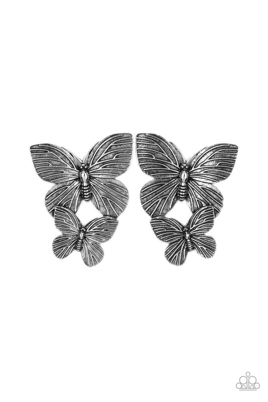 Veined with lifelike textures, a pair of rustic silver butterflies flutters from the ear for a whimsical fashion. Earring attaches to a standard post fitting.  Sold as one pair of post earrings.