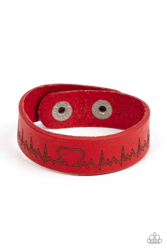 Culminating into a heart at the center, a zigzagging pattern reminiscent of a heartbeat is etched across the front of a red leather band around the wrist for a whimsical fashion. Features an adjustable snap closure.  Sold as one individual bracelet.