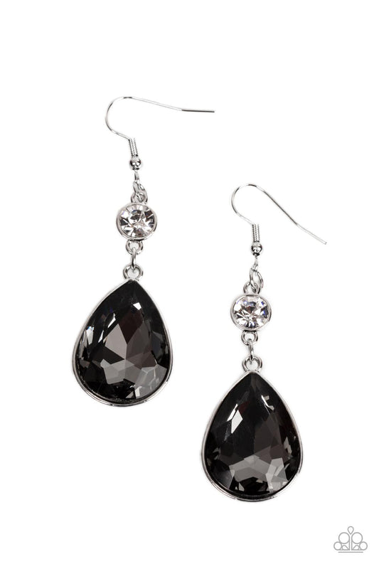 Encased in a sleek silver frame, a dramatically oversized smoky teardrop gem swings from a solitaire white rhinestone for an unapologetic sparkle. Earring attaches to a standard fishhook fitting.  Sold as one pair of earrings.