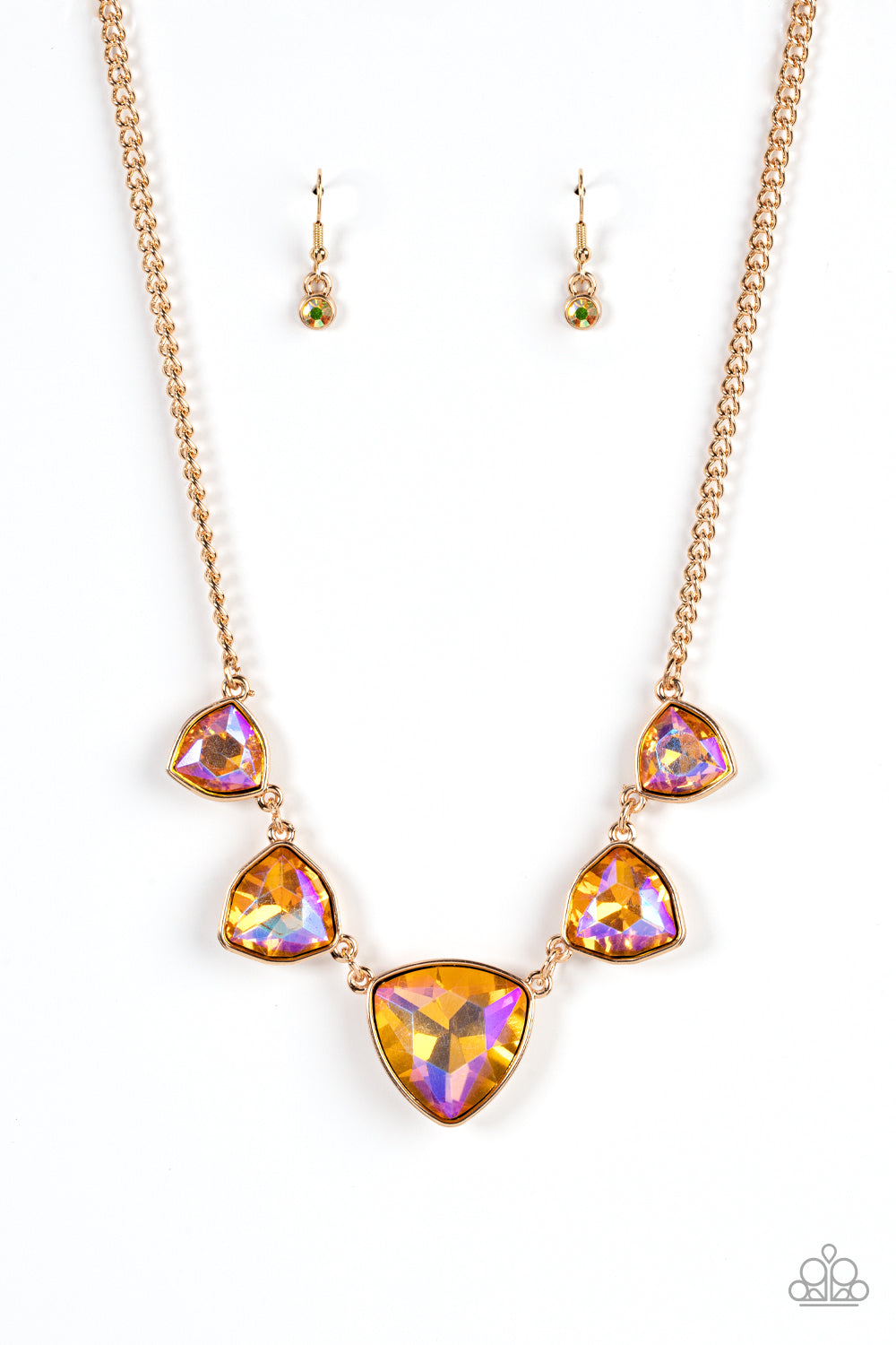 Encased in sleek gold fittings, an oversized collection of UV geometric gems gradually increase in size as they link below the collar for a golden statement. Features an adjustable clasp closure.  Sold as one individual necklace. Includes one pair of matching earrings.