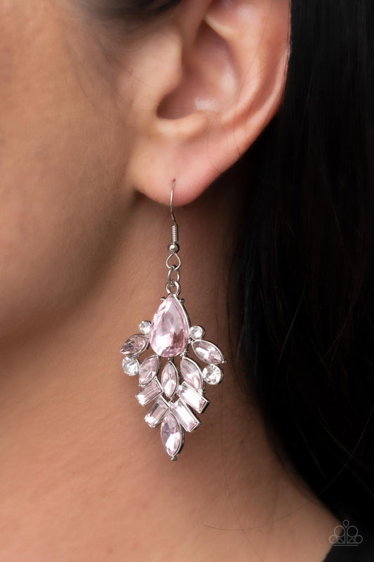 Dainty white rhinestones are sprinkled between a stunning stack of emerald, teardrop, and marquise cut pink rhinestones, resulting in a lavish lure. Earring attaches to a standard fishhook fitting.  Sold as one pair of earrings.