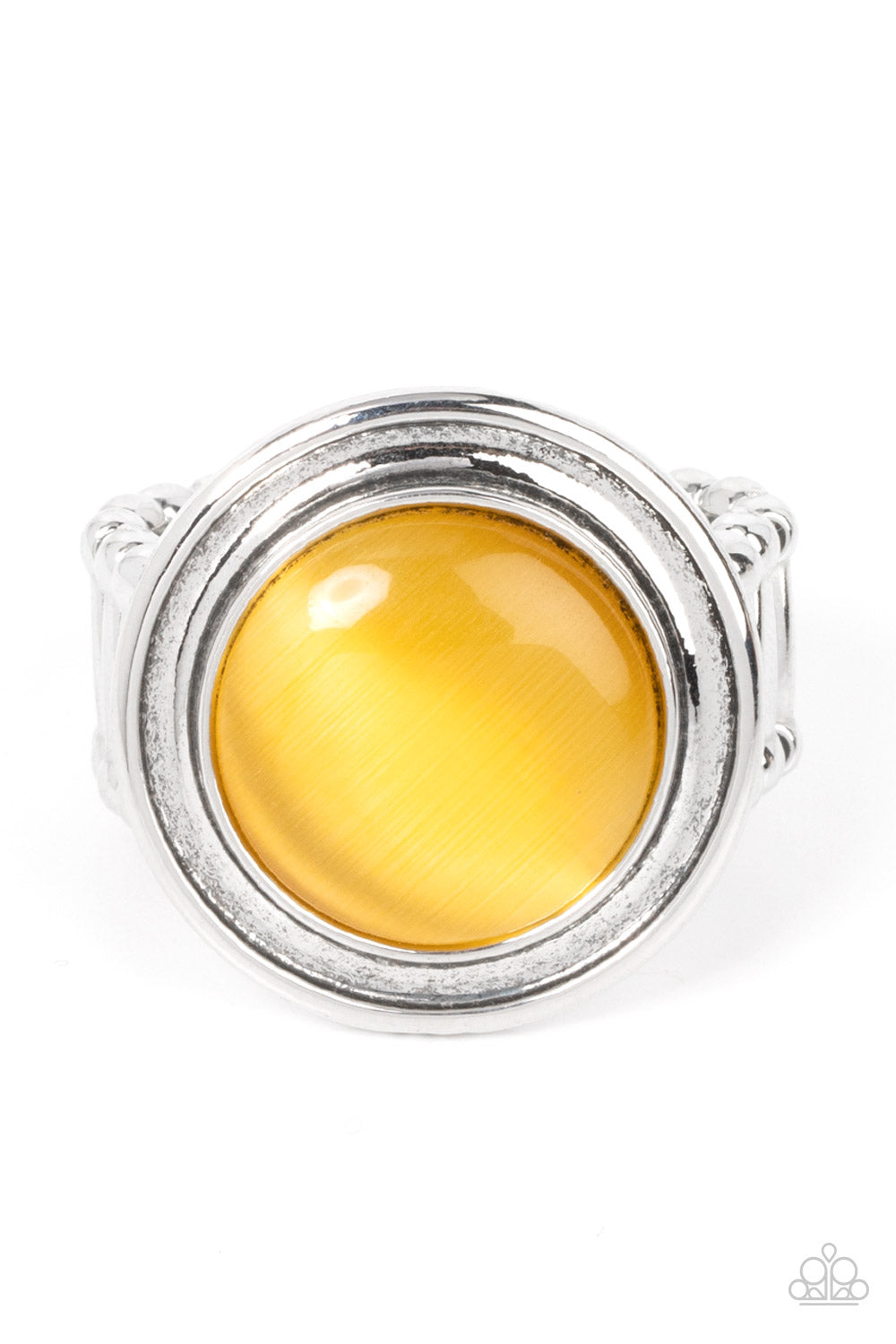 A yellow cat's eye stone is encircled in rippling silver frames, pooling into an ethereal pop of color atop the finger. Features a stretchy band for a flexible fit.  Sold as one individual ring.