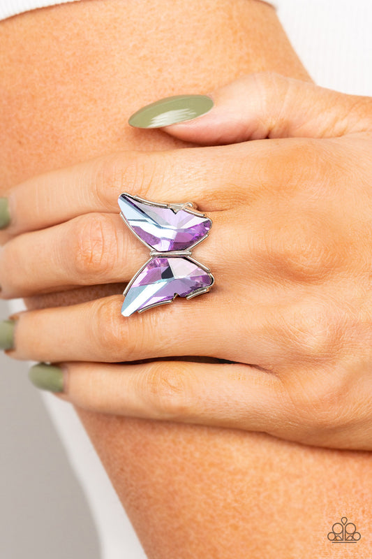 Featuring a stellar UV finish, a pair of glittery purple gems adorns the wings of a silver butterfly atop the finger for an eye-catching finish. Features a stretchy band for a flexible fit. Due to its prismatic palette, color may vary.  Sold as one individual ring.
