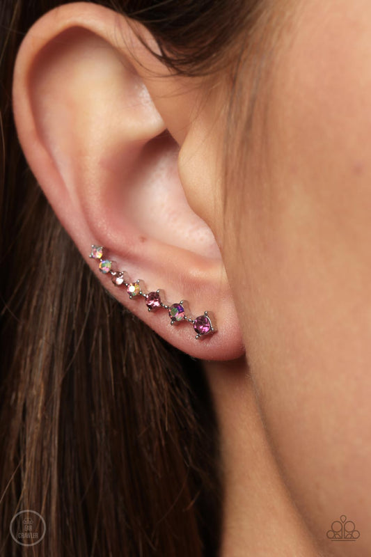 An iridescent spectrum of dainty pink rhinestones gradually increase in intensity as they climb the ear for a stellar fashion. Features an extended post fitting that climbs the back of the ear and can be pressed together for a more secure fit.  Sold as one pair of ear crawlers.  New Kit New Kit
