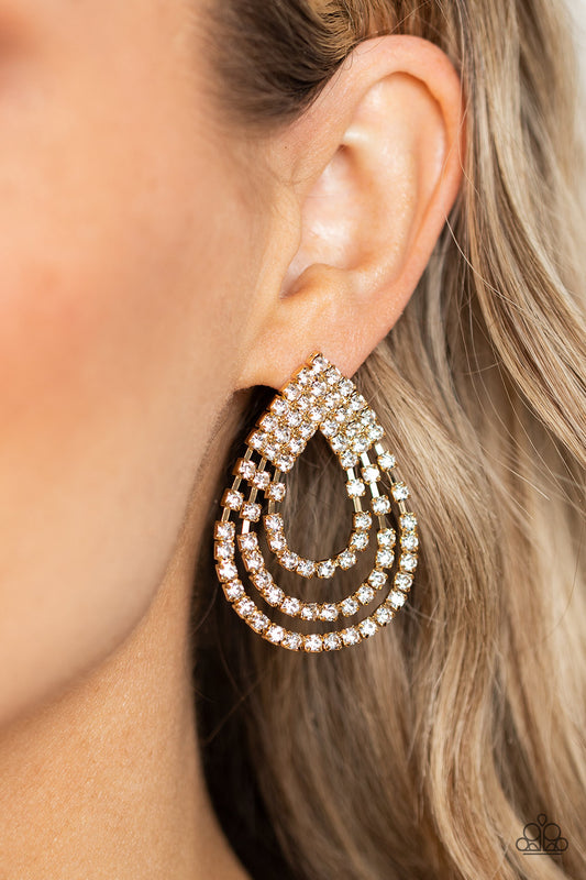 Loops of glassy white rhinestones ripple out from the bottom of a stationary triangular fitting that is dotted in glittery white rhinestones, resulting in a timeless teardrop chandelier. Earring attaches to a standard post fitting.  Sold as one pair of post earrings.