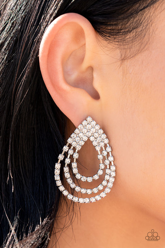 Loops of glassy white rhinestones ripple out from the bottom of a stationary triangular fitting that is dotted in glittery white rhinestones, resulting in a timeless teardrop chandelier. Earring attaches to a standard post fitting.  Sold as one pair of post earrings.