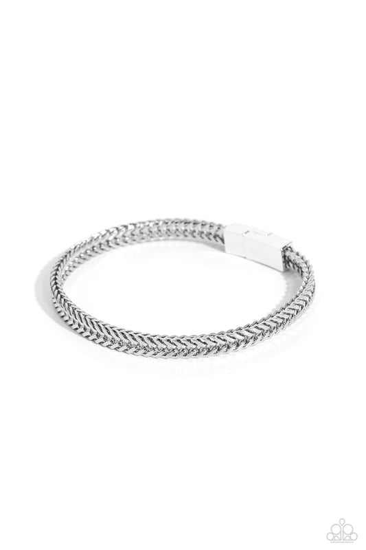 <p>Rows of angular silver links stack and interlock into a bold 3-dimensional chain around the wrist, resulting in an intense statement piece. Features a magnetic closure.</p> <p><i>Sold as one individual bracelet. </i></p> <br><b> Get The Complete Look! </b> <br>Necklace: " Downtown Defender - Silver" (Sold Separately)