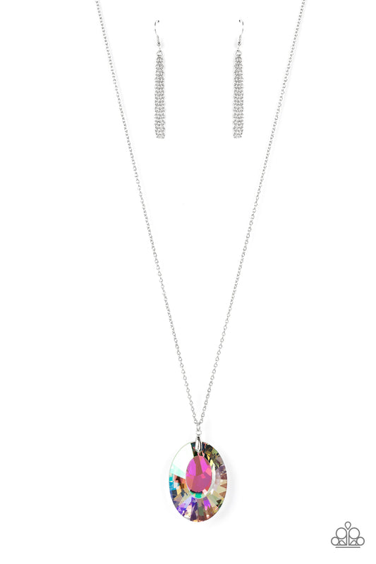Featuring a reflective focal point and an exaggerated faceted surface, a dramatically oversized, iridescent gem sparkles at the bottom of a lengthened silver chain for an out-of-this-world kind of dazzle. Features an adjustable clasp closure. Due to its prismatic palette, color may vary.  Sold as one individual necklace. Includes one pair of matching earrings.