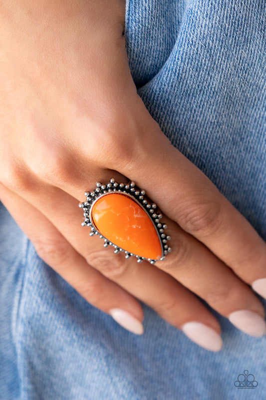 Chiseled into a tranquil teardrop, a refreshing orange stone is pressed into the center of a studded silver frame for an earthy ensemble. Features a stretchy band for a flexible fit.  Sold as one individual ring.
