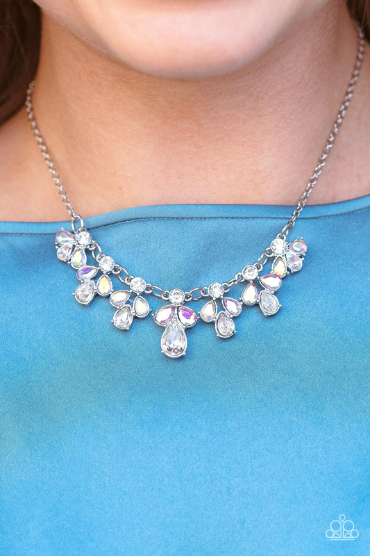 Featuring a refracted shimmer, asymmetrical, glassy purple gems sparkle atop textured silver discs as they delicately link into an edgy statement piece below the collar. Features an adjustable clasp closure.  Sold as one individual necklace. Includes one pair of matching earrings.