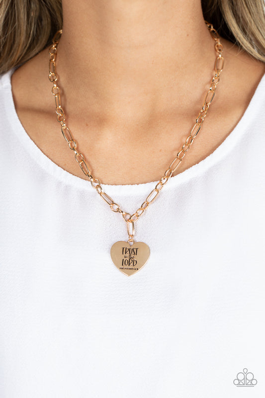Dangling from a gold figaro chain, a charming heart pendant swings. Stamped upon the shiny surface, the phrase "Trust in the Lord" with the bible reference listed below it "Proverbs 3:5" are listed in different fonts for an optimistic and hopeful finish. Features an adjustable clasp closure.  Sold as one individual necklace. Includes one pair of matching earrings.