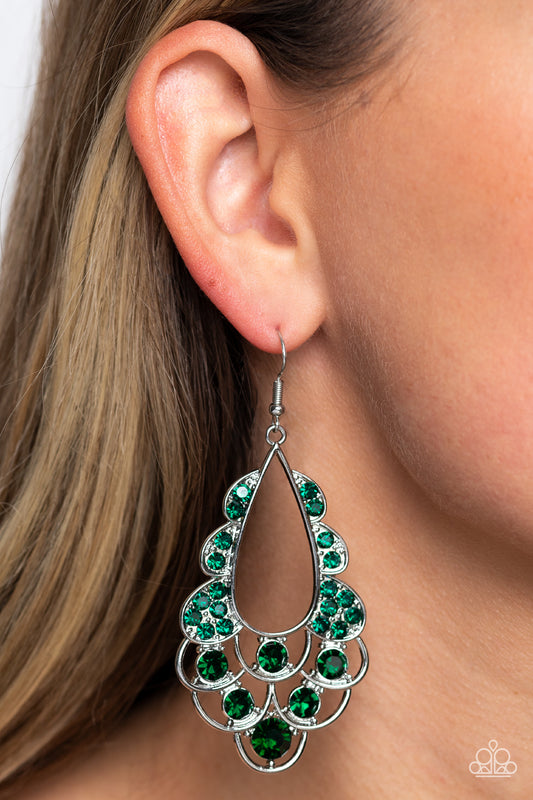 Airy loops of high-sheen silver, dotted with glittery emerald faceted gems, ripple out from an airy teardrop shape. Some curls feature solitaire oversized gems, while others feature a dainty collection resulting in a timeless, incandescent teardrop chandelier below the ear. Earring attaches to a standard fishhook fitting.  Sold as one pair of earrings.