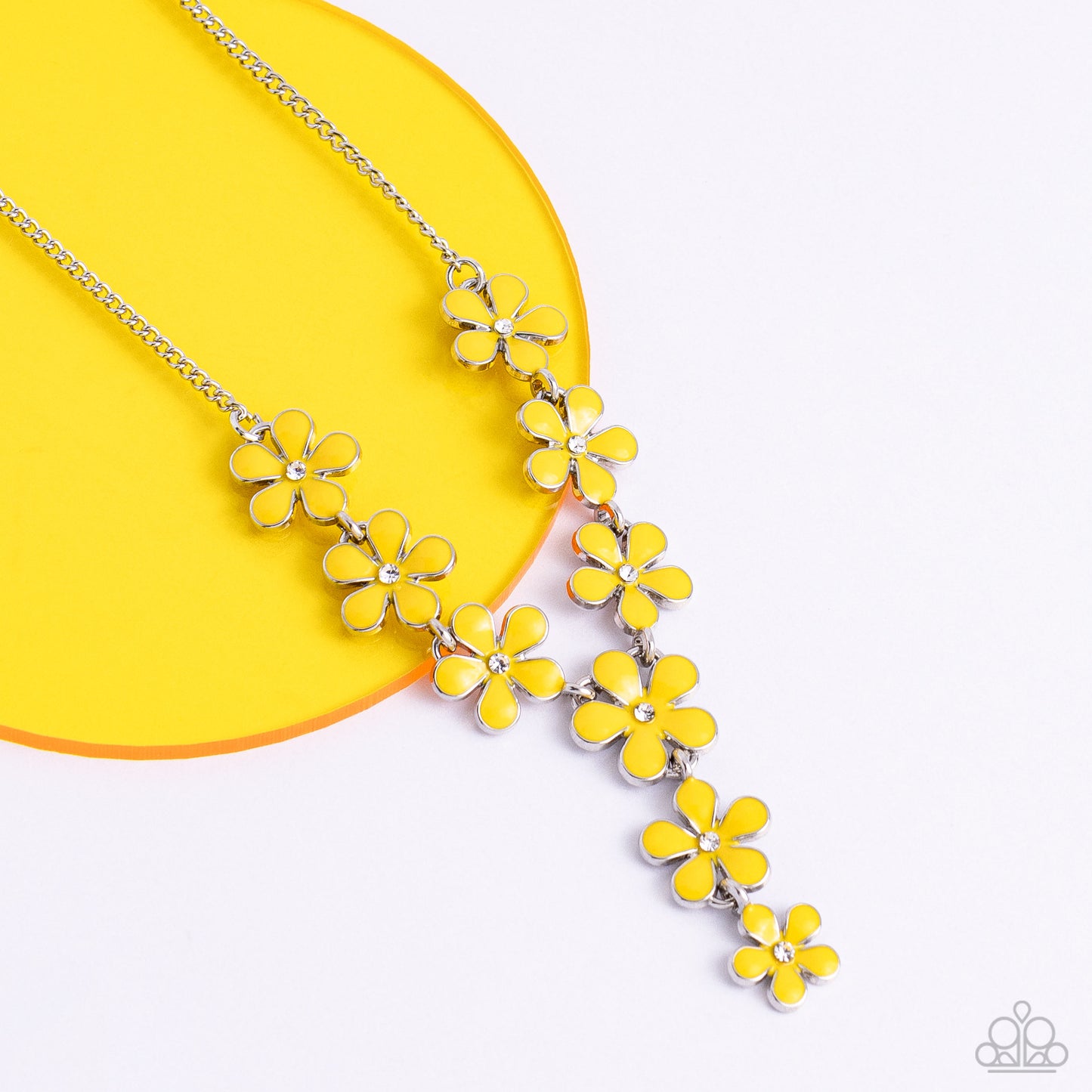 Dotted with white rhinestone centers, whimsical Primrose paint flowers delicately link into an extended pendant below the collar for an ethereal fashion. Features an adjustable clasp closure.  Sold as one individual necklace. Includes one pair of matching earrings.